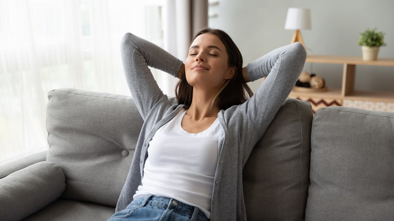 woman relaxing on sofa