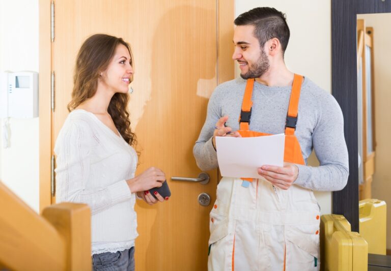 VIGILANT woman talking to HVAC professional shutterstock