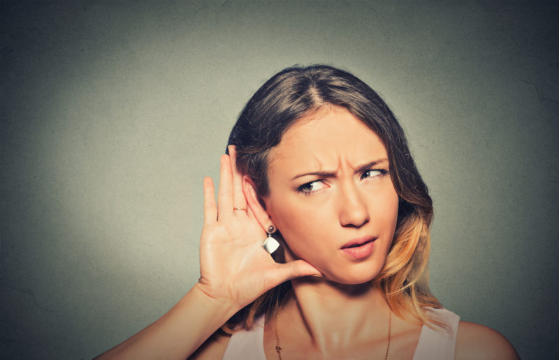 woman hearing something