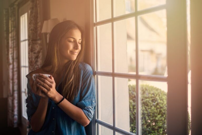 woman enjoying whole-house air purifier